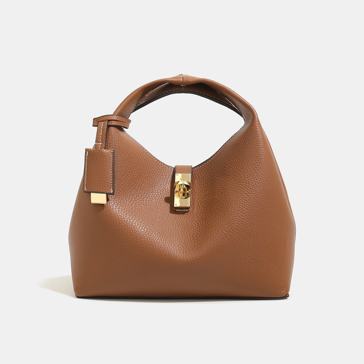 Structured pebbled leather-look bucket bag with gold-tone turn-lock clasp and looped top handle, detail view 7