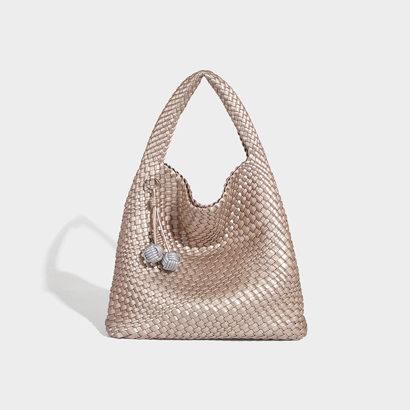 Soft hand-woven slouchy hobo tote bag with knotted tassel charm and single looped shoulder strap, detail view 11