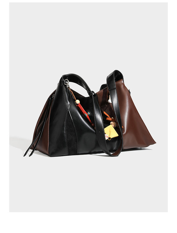 Two-tone black and brown leather-look slouchy shoulder bag with beaded tassel charm and silver-tone hardware, detail view 7