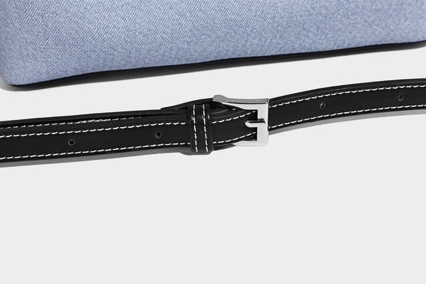 Structured light-blue denim-look tote bag with black leather-look handles, white contrast stitching, silver-tone hardware