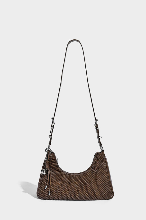 Woven crescent hobo shoulder bag with smooth side panels, zip-top closure, silver-tone charm hardware, and adjustable, detail
