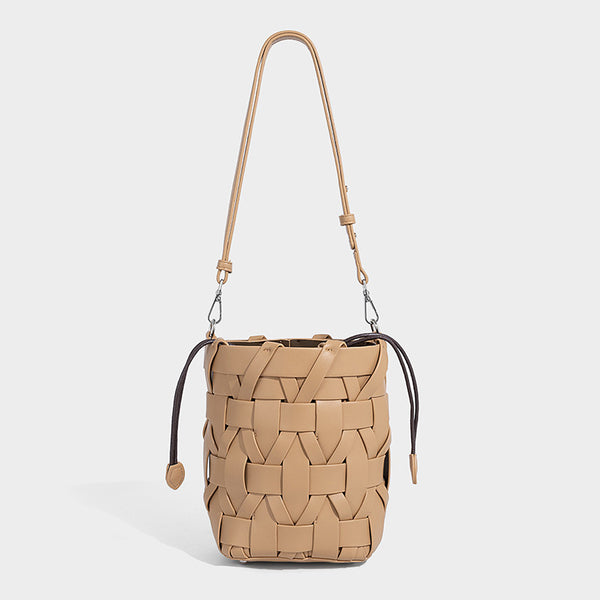 Small woven leather-look bucket bag with interlaced strip exterior, drawstring closure, and adjustable crossbody strap