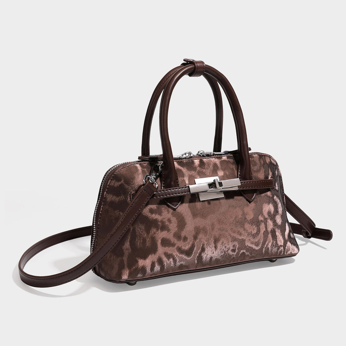 Structured satchel bag in tonal leopard print with smooth leather-look trim, rolled top handles, front turn-lock clasp, and