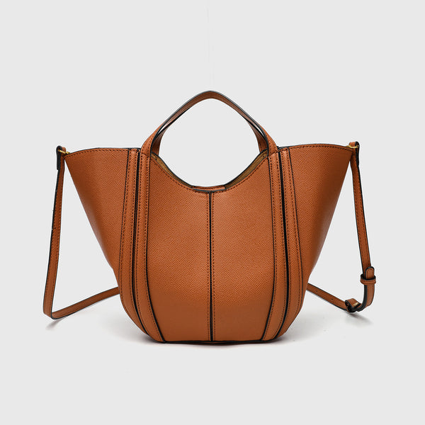 Structured open-top tote bag in tan brown pebbled leather-look finish with vertical seam accents, black edge piping, curved