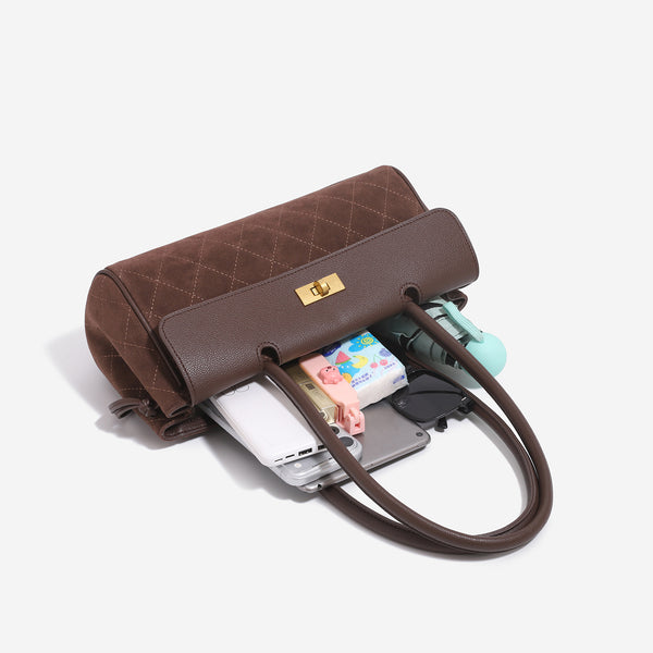 Structured rectangular baguette shoulder bag with diamond quilted lower panel, smooth flap, gold-tone turn-lock closure