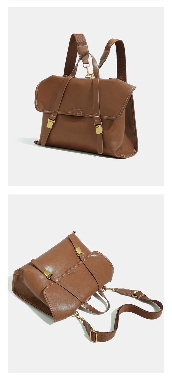 Structured flap-over backpack satchel in smooth leather-look finish with gold-tone buckle hardware and top handle, detail