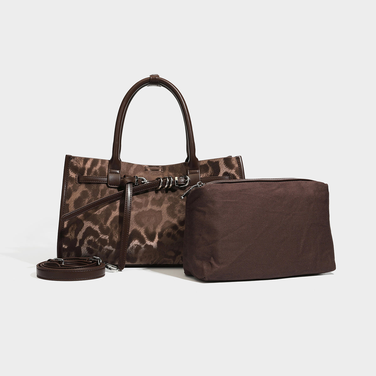 Structured leopard-print tote bag with glossy satin-like finish, dual rounded top handles, silver buckle-and-ring front
