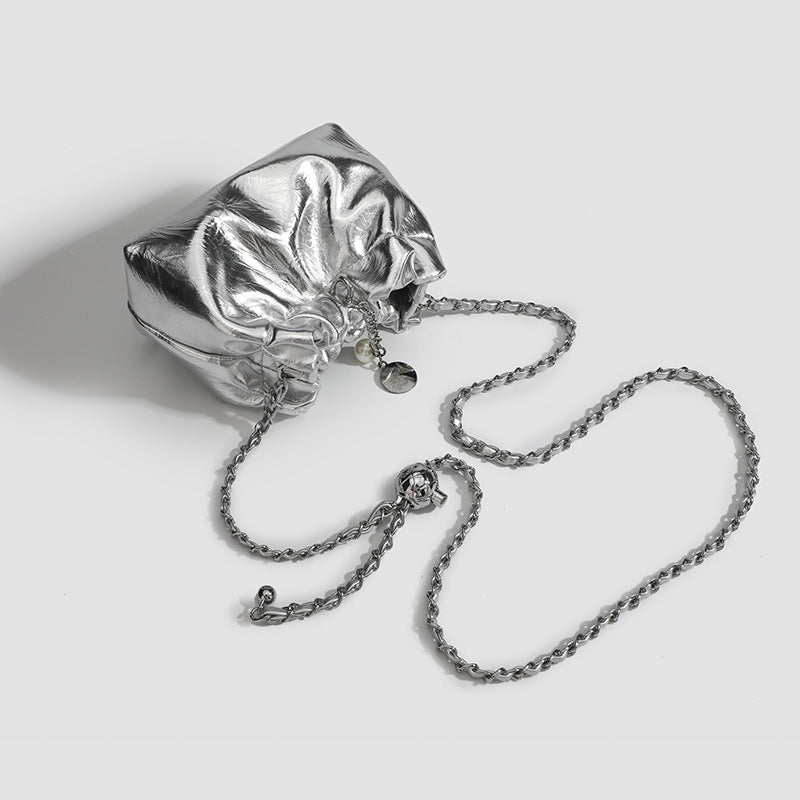 Small ruched drawstring bucket bag with twisted-link chain strap and pearl charm pull, detail view 3