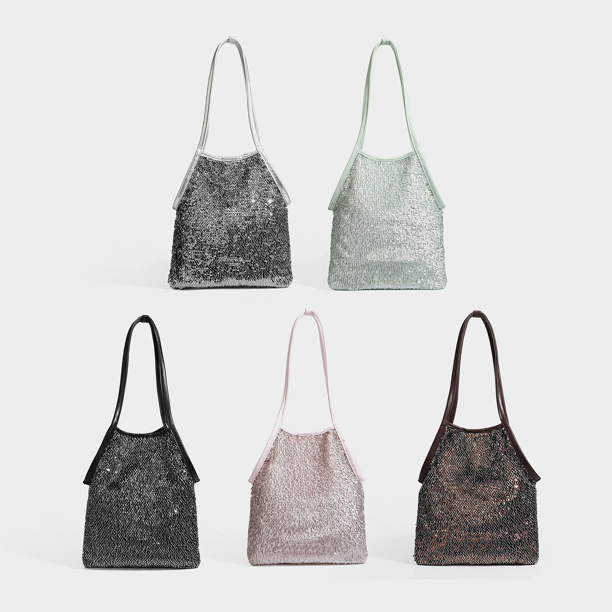 Small sequin shoulder tote bag with long metallic strap and trapezoid silhouette, detail view 2
