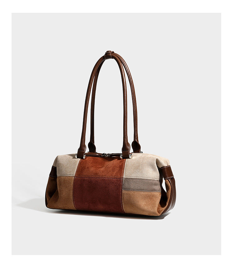 Patchwork suede-look barrel shoulder bag in brown, rust, tan, beige, and gray panels with double leather-look straps and