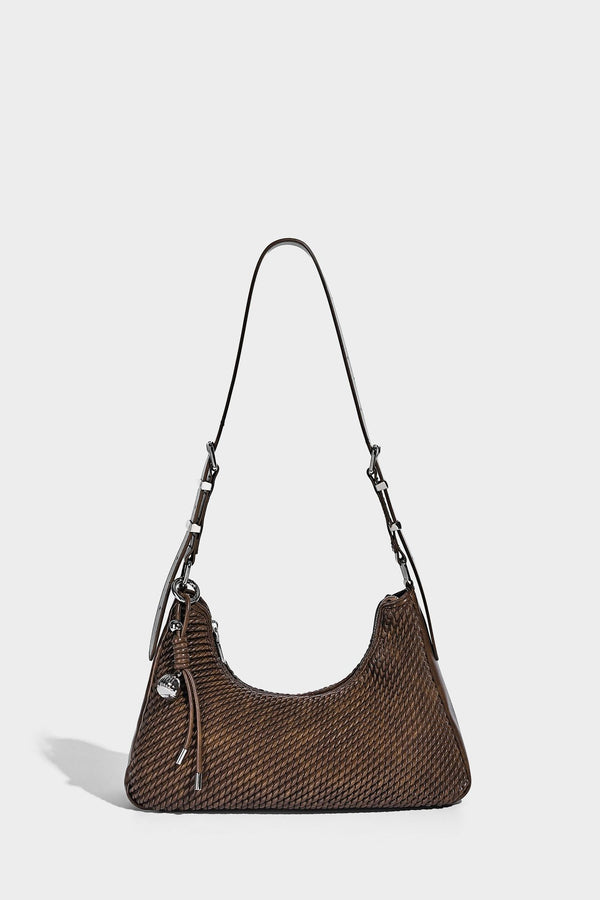 Woven crescent hobo shoulder bag with smooth side panels, zip-top closure, silver-tone charm hardware, and adjustable, detail