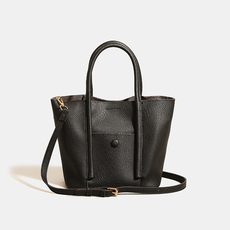 Structured pebbled matte tote bag with front snap pocket, dual top handles, and detachable zip pouch in almond beige, detail