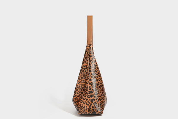 Glossy leopard-print slouchy shoulder bag with long strap and detachable tan zip pouch, detail view 25
