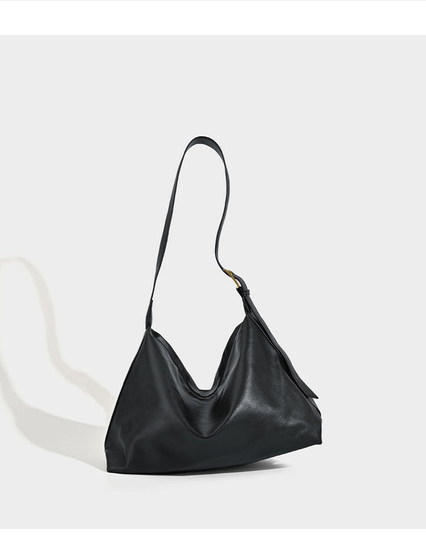 Large slouchy hobo shoulder bag in smooth black leather-look finish with gold-tone buckle hardware and adjustable strap