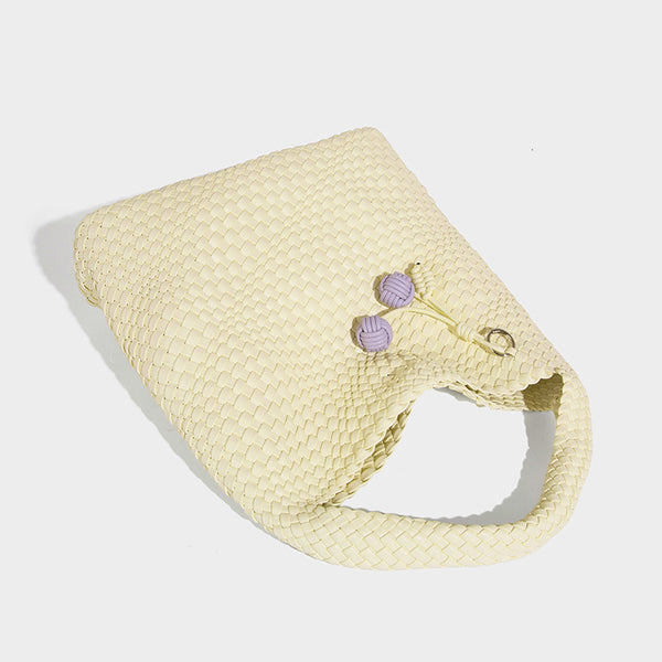 Soft hand-woven slouchy hobo tote bag with knotted tassel charm and single looped shoulder strap, detail view 35