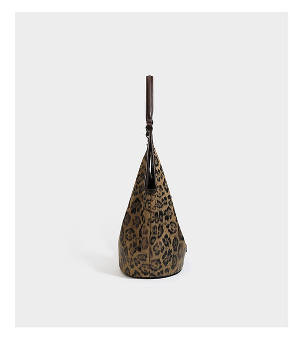 Large slouchy leopard-print shoulder tote bag with glossy tan-and-brown finish, dark brown leather-look trim, single