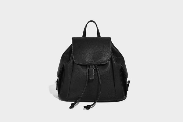Compact pebbled leather-look flap drawstring backpack handbag with side pockets, top handle, and silver-tone hardware, detail