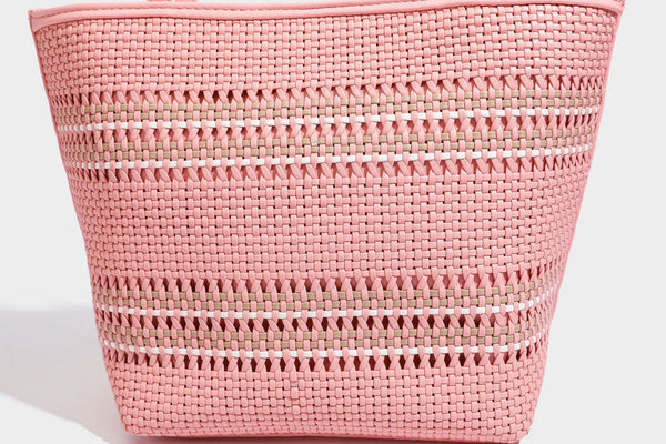 Large structured woven tote bag with striped basket-weave finish, long shoulder straps, and detachable mini pouch charm