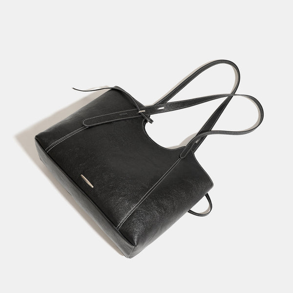 Structured open-top leather-look tote bag with long shoulder straps, contrast stitching, and side tie details, detail view 4