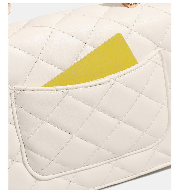 Small structured quilted flap crossbody bag with gold-tone turn-lock closure and chain strap, detail view 14