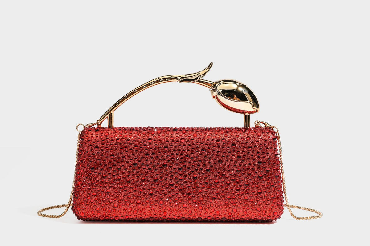 rectangular hard-case rhinestone evening clutch with sculptural gold-tone branch-and-bud top handle and detachable chain