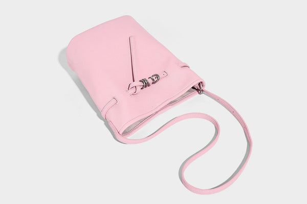 Small pebbled leather-look bucket bag with front drawstring toggle hardware and long adjustable shoulder strap, detail view