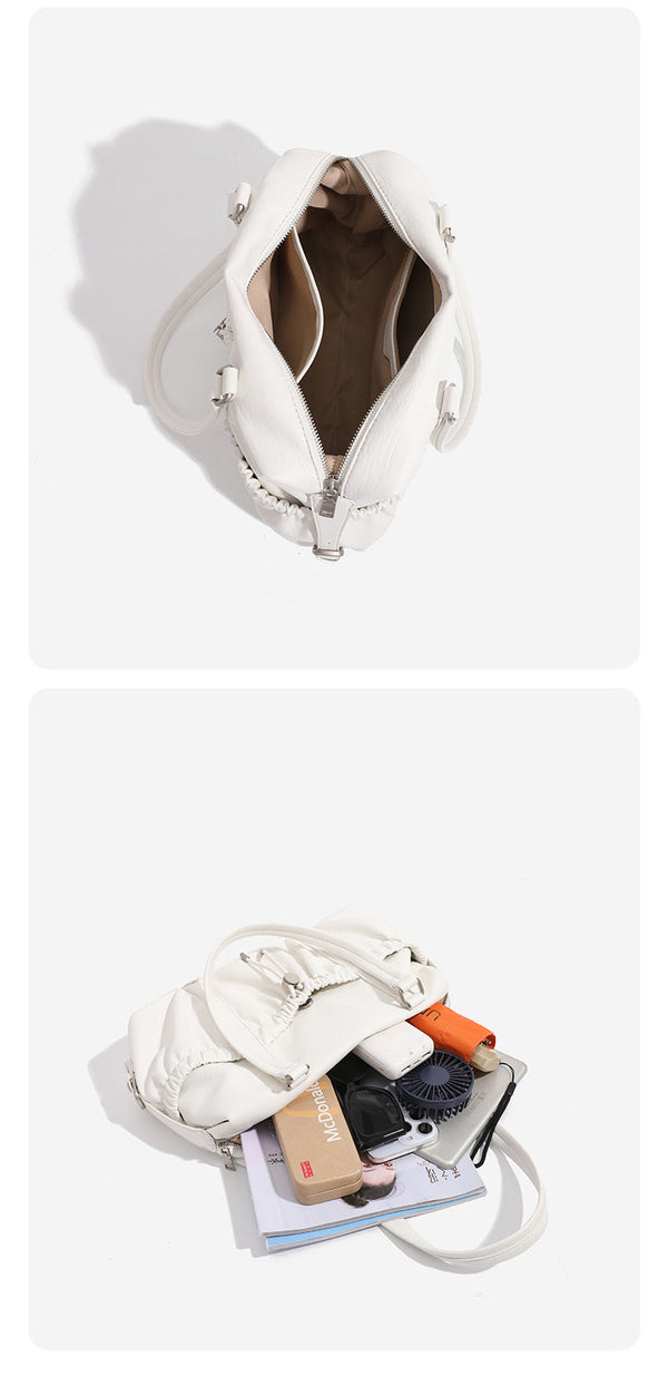 Ivory leather-look shoulder bag with ruched front panels, drawstring toggle, silver-tone hardware, and dual top handles