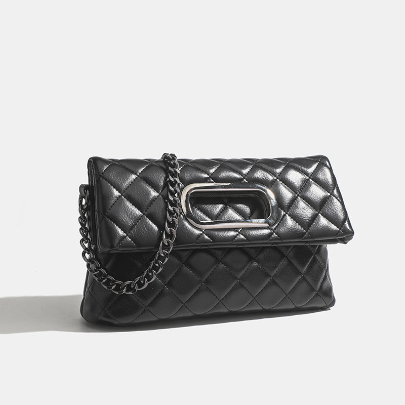 Quilted diamond-stitch flap crossbody bag with gunmetal chain strap and cut-out bar handle, detail view 6