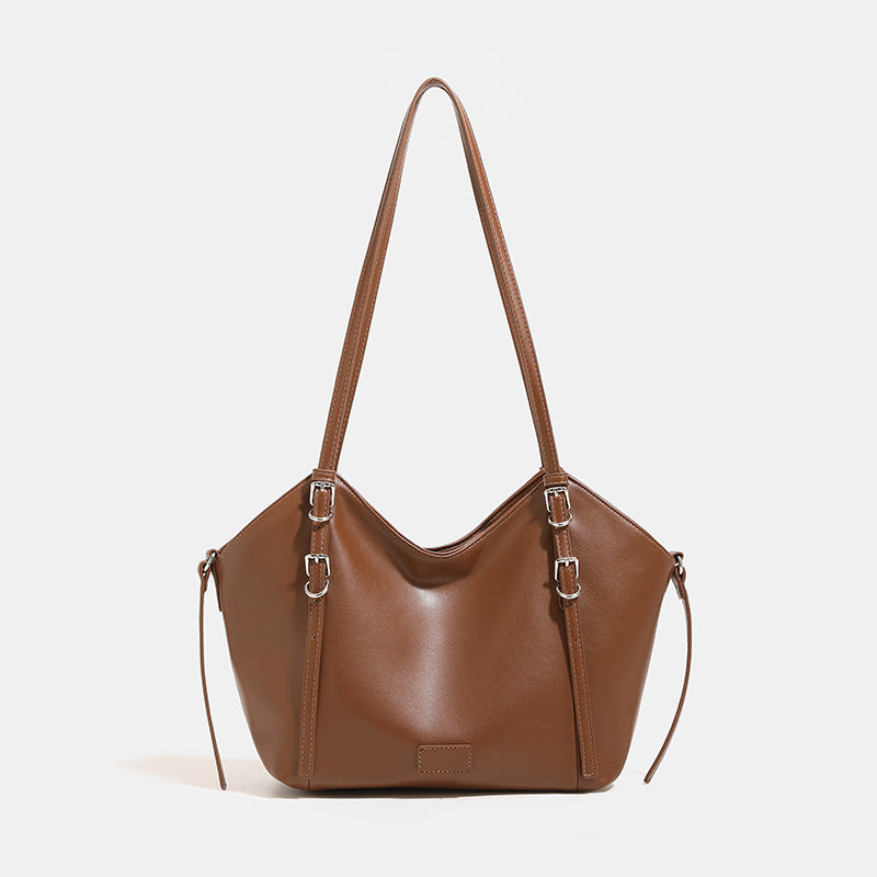 Glatte Tote-Schultertasche aus Lederimitat mit silberfarbenen Schnallenbeschlägen und zwei Schulterriemen, Detailansicht 8