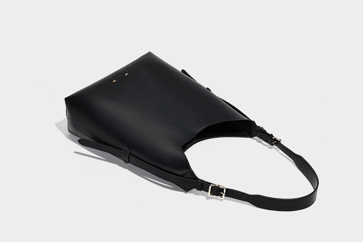 Large open-top hobo shoulder bag in tan leather-look finish with detachable zip pouch and adjustable buckle strap, detail
