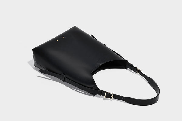 Large open-top hobo shoulder bag in tan leather-look finish with detachable zip pouch and adjustable buckle strap, detail