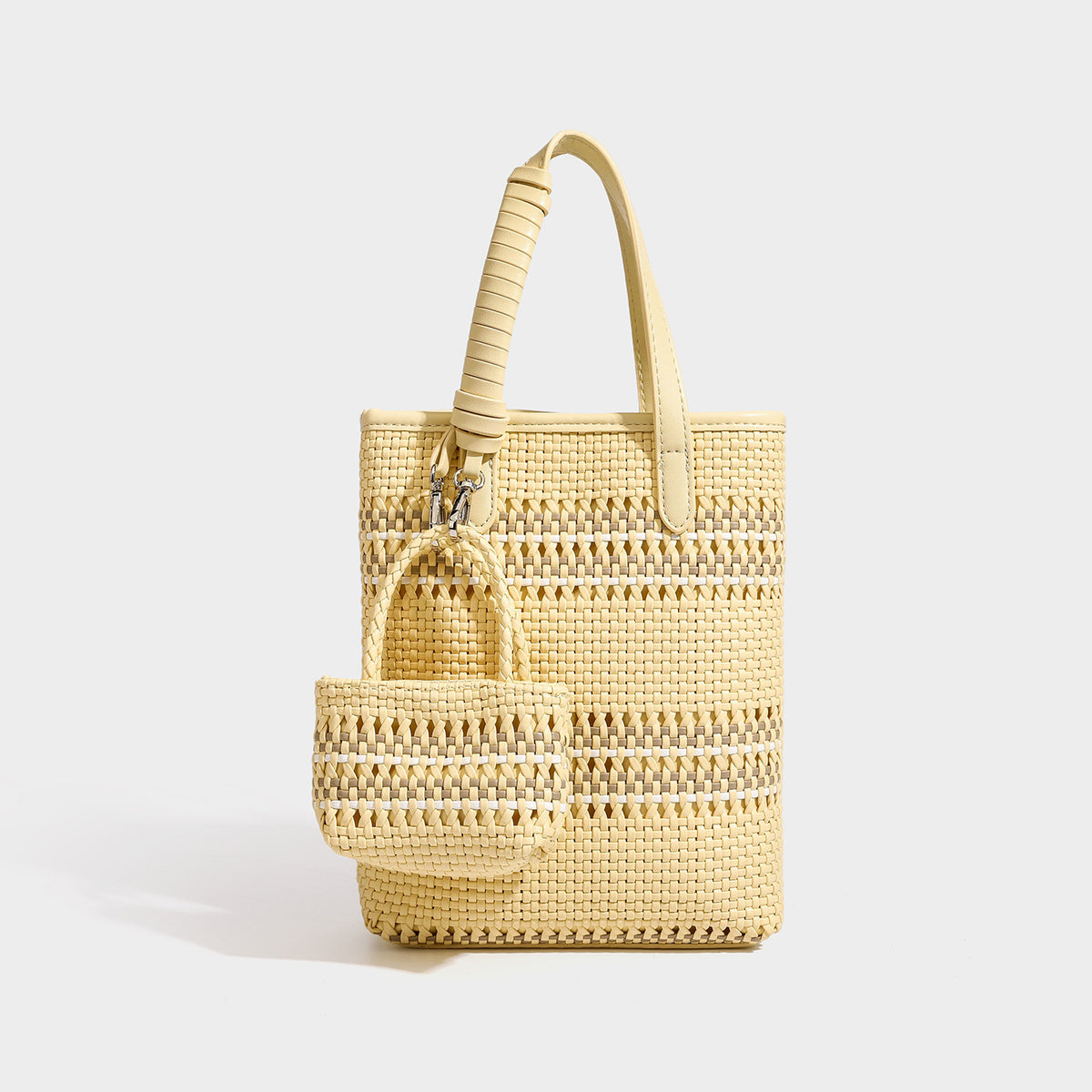 Small structured woven basket tote bag with wrapped leather-look handles and silver-tone clasp hardware, front view
