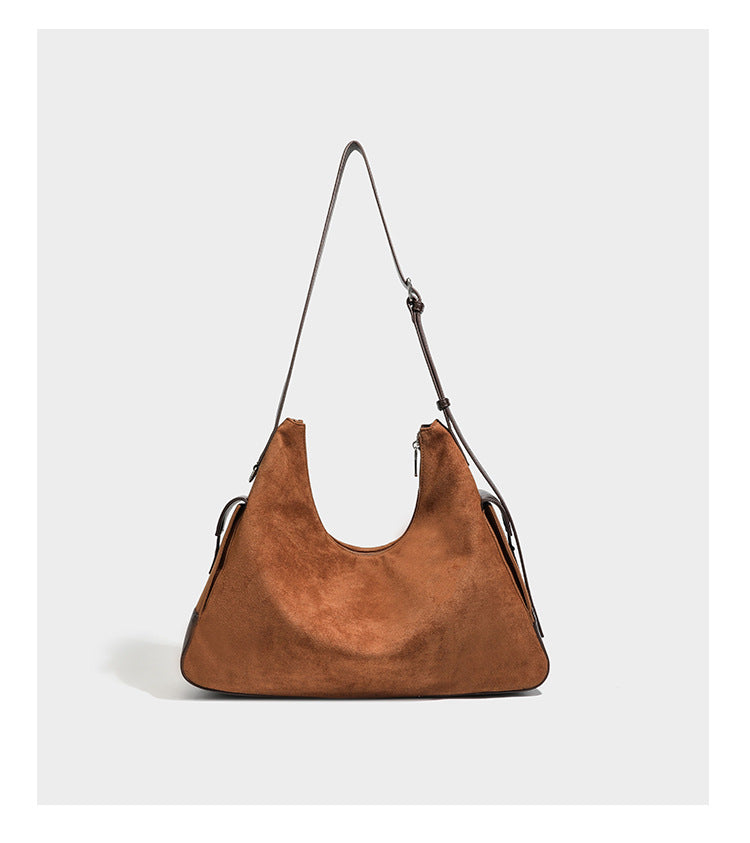Slouchy cognac brown matte suede-look hobo shoulder bag with dark brown leather-look trim, top zip closure, front flap