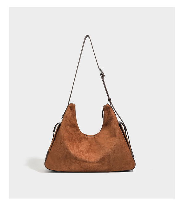 Slouchy cognac brown matte suede-look hobo shoulder bag with dark brown leather-look trim, top zip closure, front flap