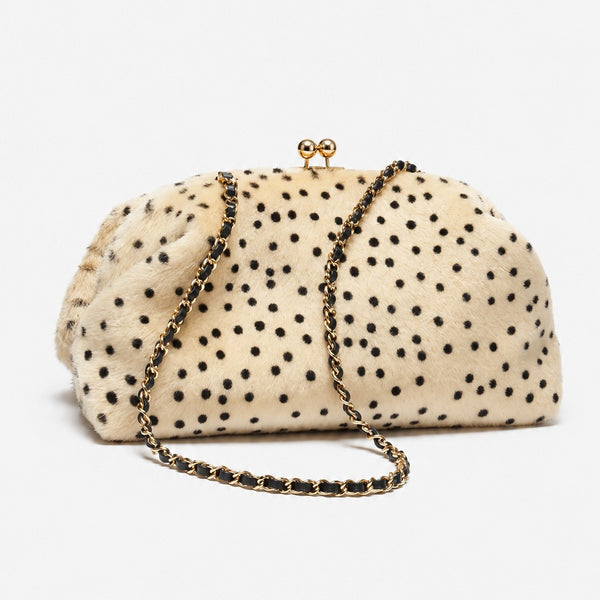 Rounded spotted faux-fur kiss-lock clutch bag with gold-tone chain strap in cream with black dot print, detail view 2