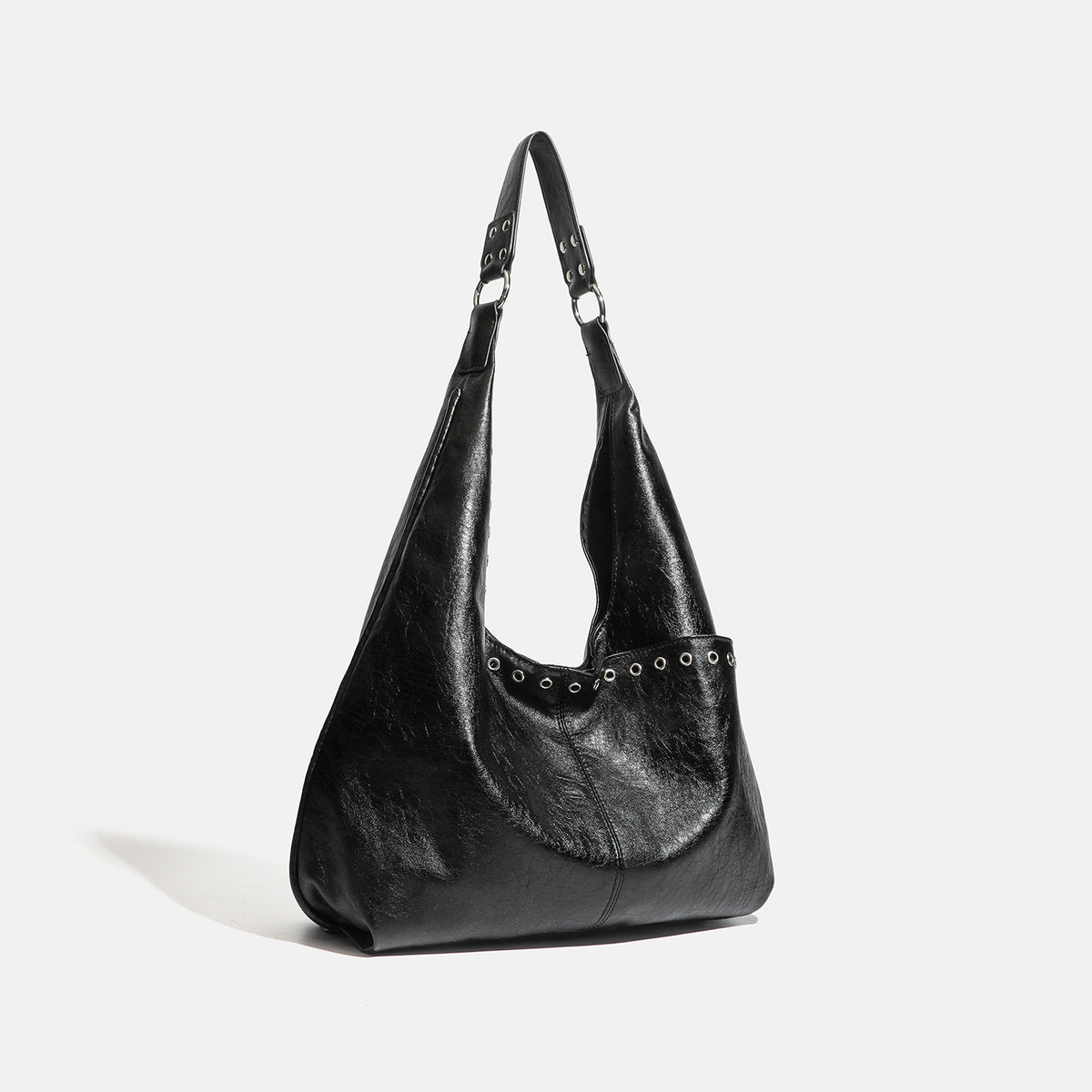 Large slouchy hobo shoulder bag with silver eyelet trim and glossy leather-look finish, detail view 2