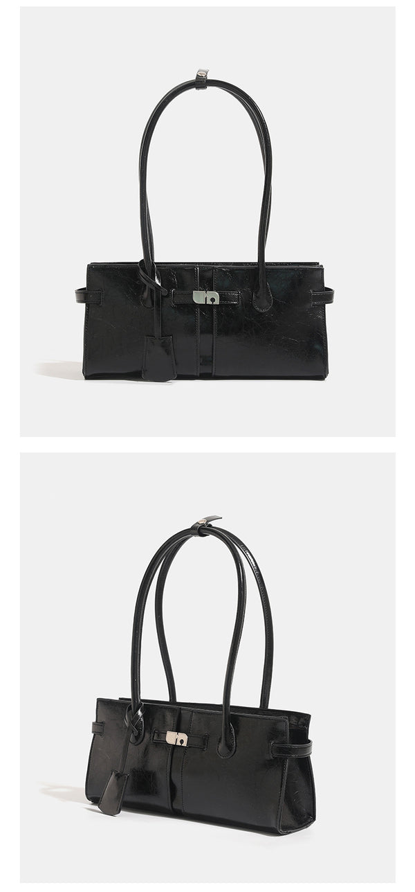 Structured glossy leather-look tote bag with long loop handles and silver turn-lock buckle closure, detail view 11