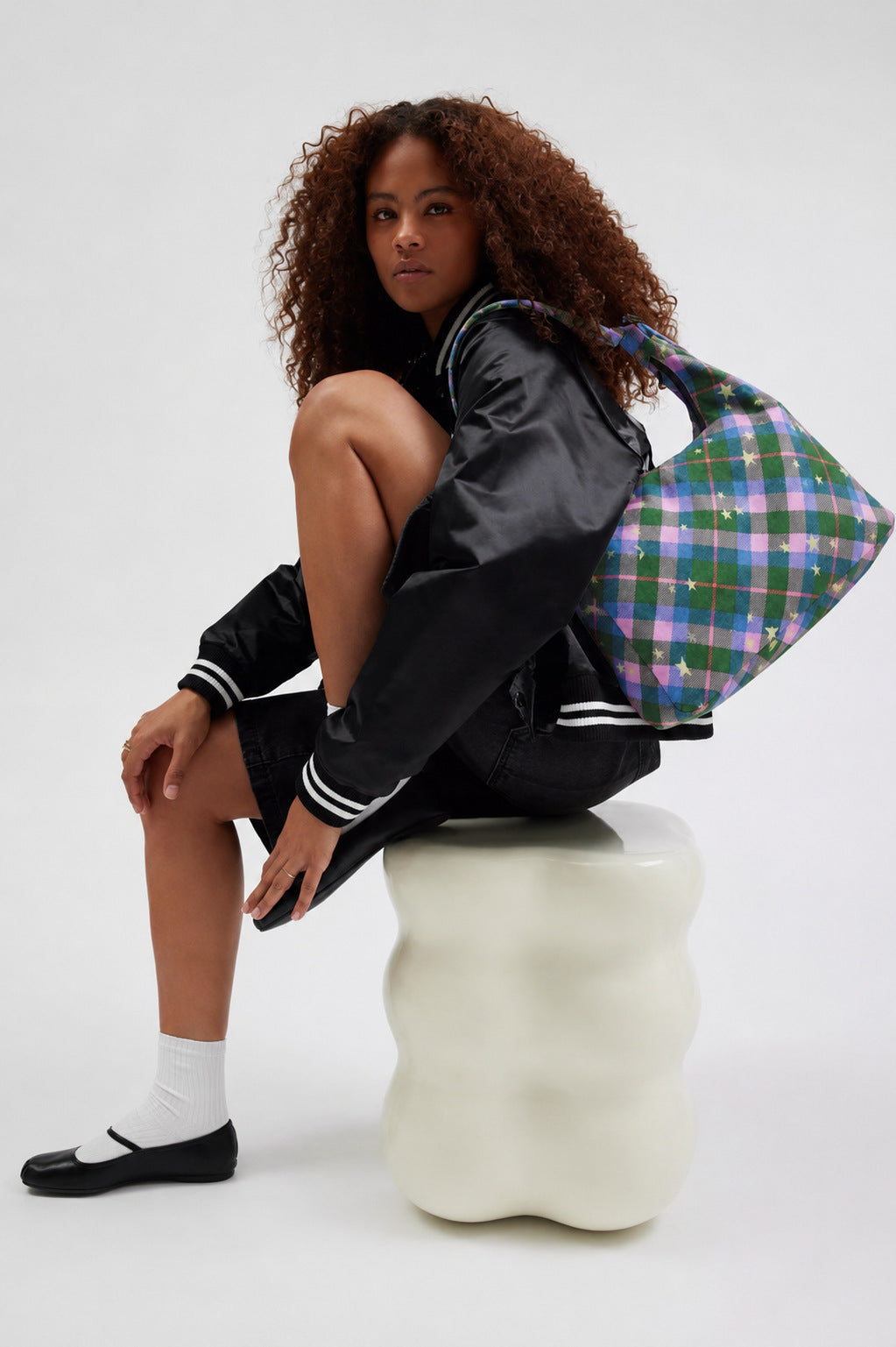 Multicolor plaid and star print hobo shoulder bag with knotted strap and silver-tone zip closure, detail view 10