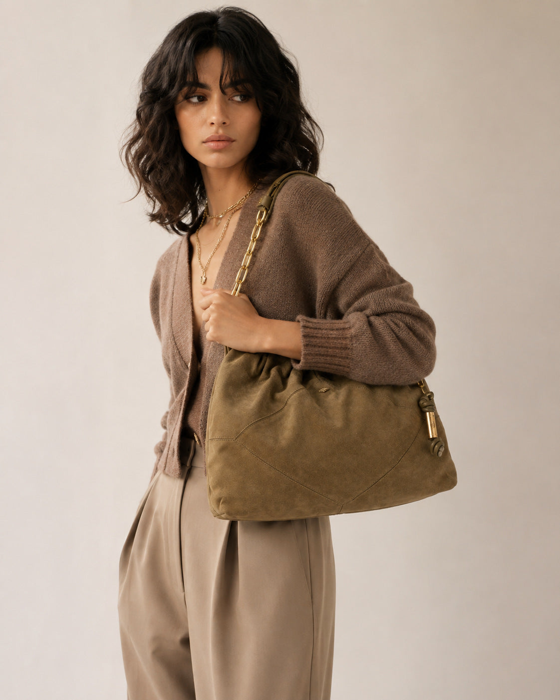 Slouchy suede-look shoulder bag with gathered top, angular stitched paneling, and chunky gold-tone chain strap, detail view 9