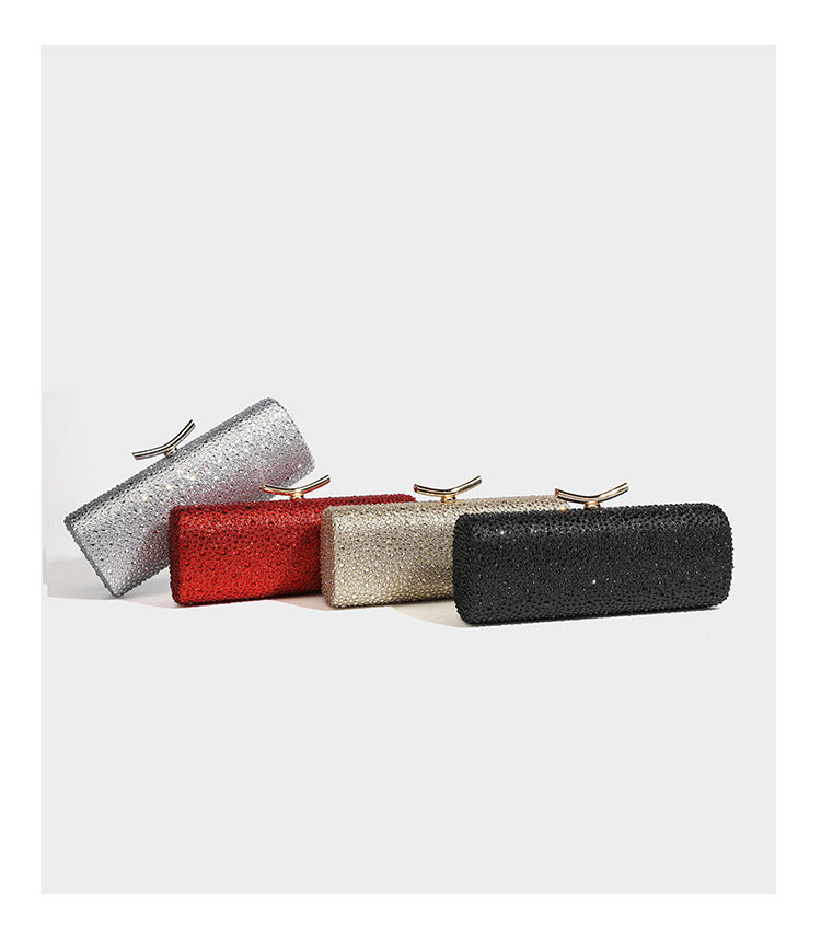 Structured rectangular hard-case clutch bag covered in all-over rhinestone crystal embellishment with curved kiss-lock top