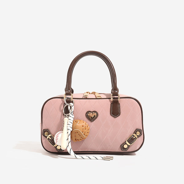Small structured blush pink quilted diamond Boston barrel bag with brown leather-look trim, double top handles, heart accent