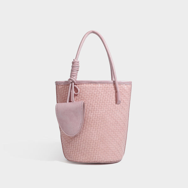 Structured woven-texture leather-look bucket bag in brown with knotted top handles, small front flap pouch, and adjustable