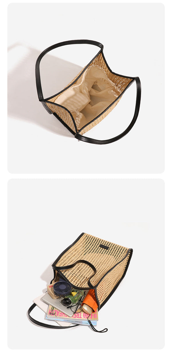 Tan open-weave raffia tote bag with black leather-look trim and long black shoulder straps, trapezoid silhouette, detail view
