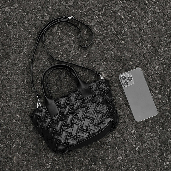 Small black glossy woven tote bag with dual top handles and detachable shoulder strap, detail view 4