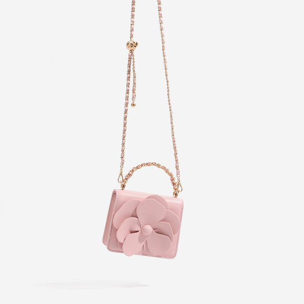 Small structured rectangular crossbody bag with layered 3D flower appliqué and gold-tone chain strap, detail view 3