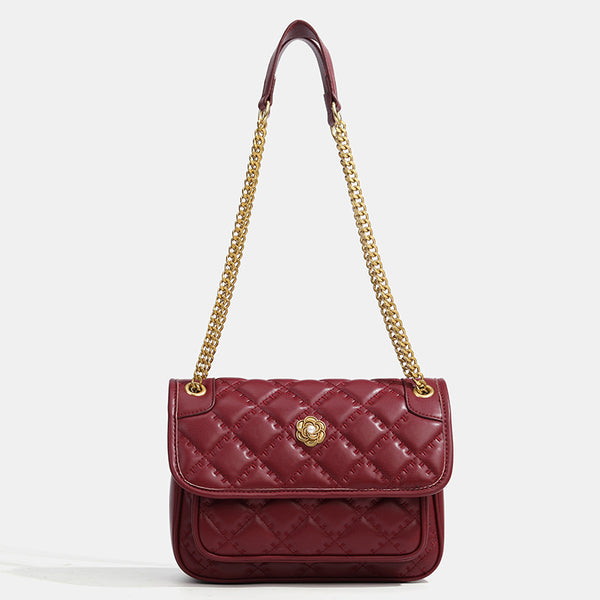 Compact diamond-quilted flap shoulder bag with gold-tone chain strap and floral turn-lock clasp, detail view 8