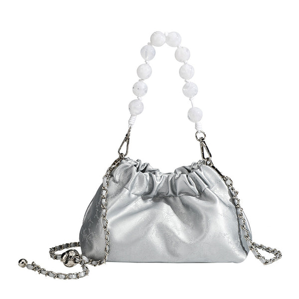 Small ruched drawstring pouch bag with pearl-bead handle and silver-tone chain strap, detail view 5