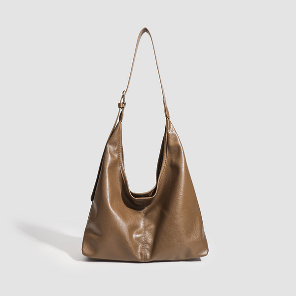Large slouchy hobo shoulder bag in smooth leather-look finish with adjustable strap and gold-tone hardware, detail view 8