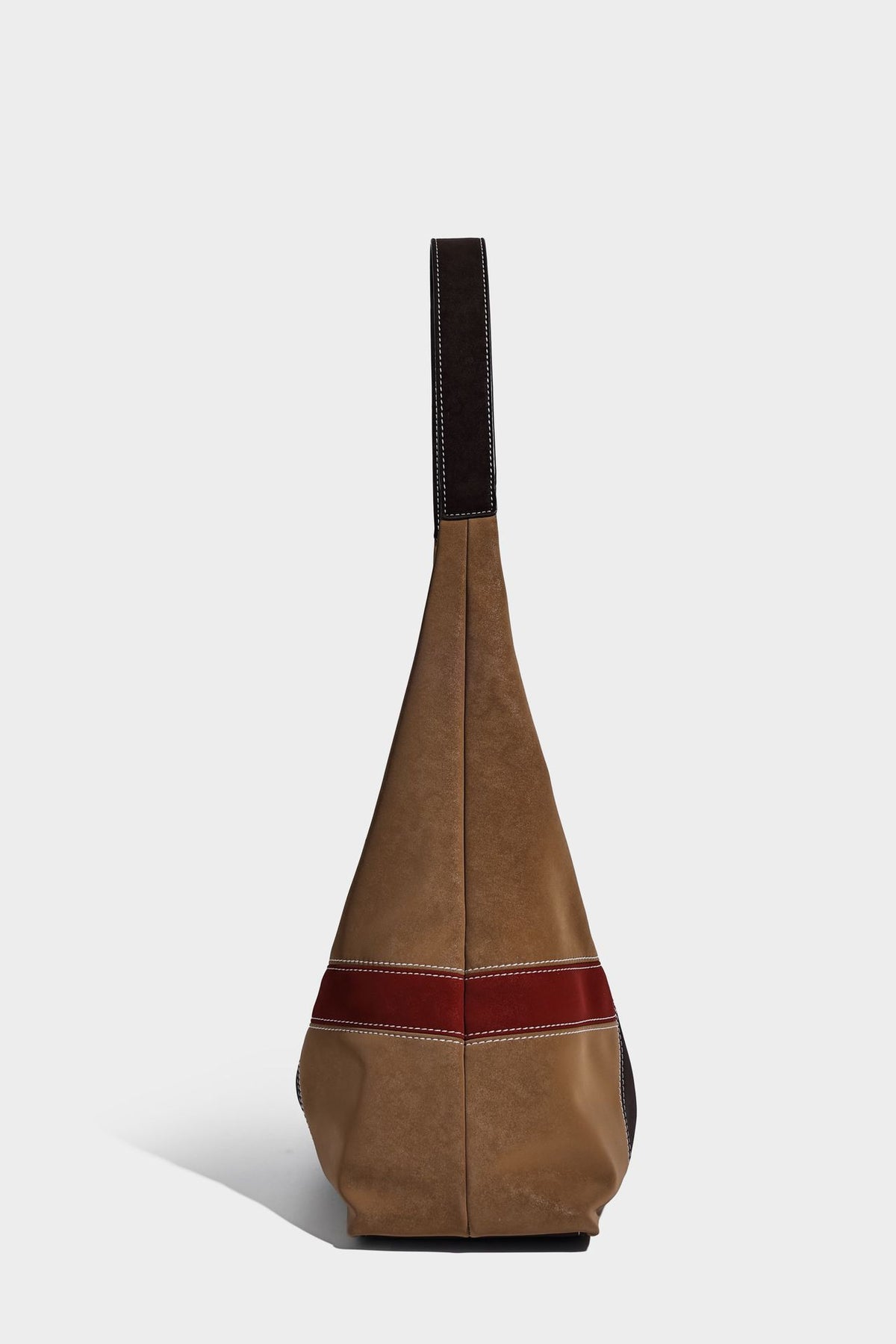 Multicolor patchwork hobo shoulder bag with brown tan olive mustard red and blue suede-look panels, contrast white stitching