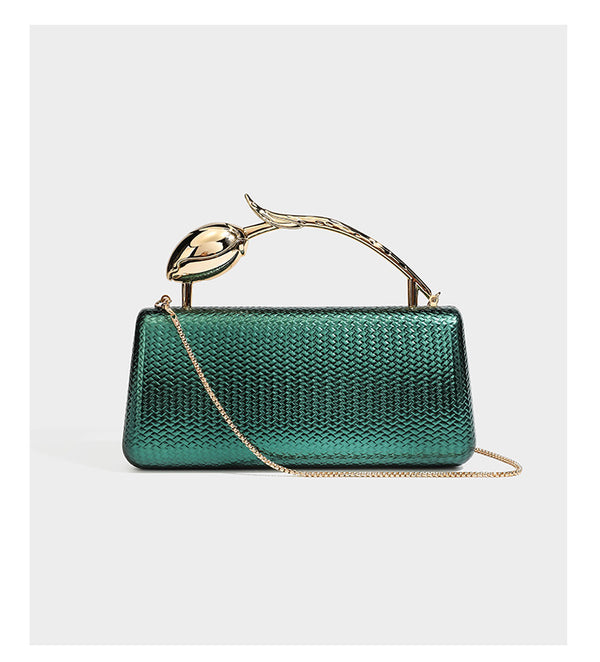 Structured rectangular metallic woven clutch bag with sculptural gold-tone leaf top handle and detachable chain strap, detail